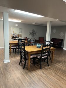 A community room with tables and chairs