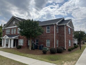 A two story brick apartment building