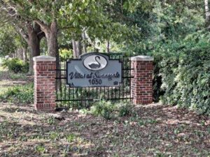 The entrance sign to Villas at Swansgate apartments