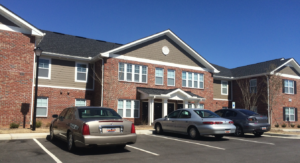 A two story brick apartment building