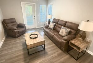 Living room with large window and door