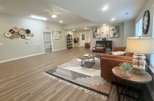 Community room with couch and chair