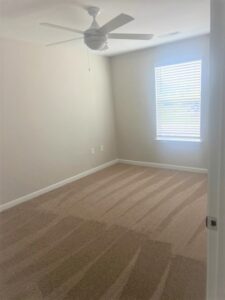 A bedroom with a sunny window