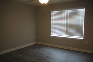 A bedroom with a sunny window