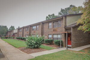 A two story brick apartment building