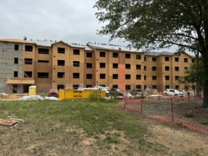 A four story apartment building that is under construction.