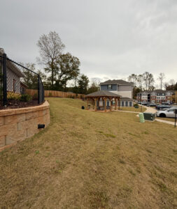 A grassy area of an apartment community